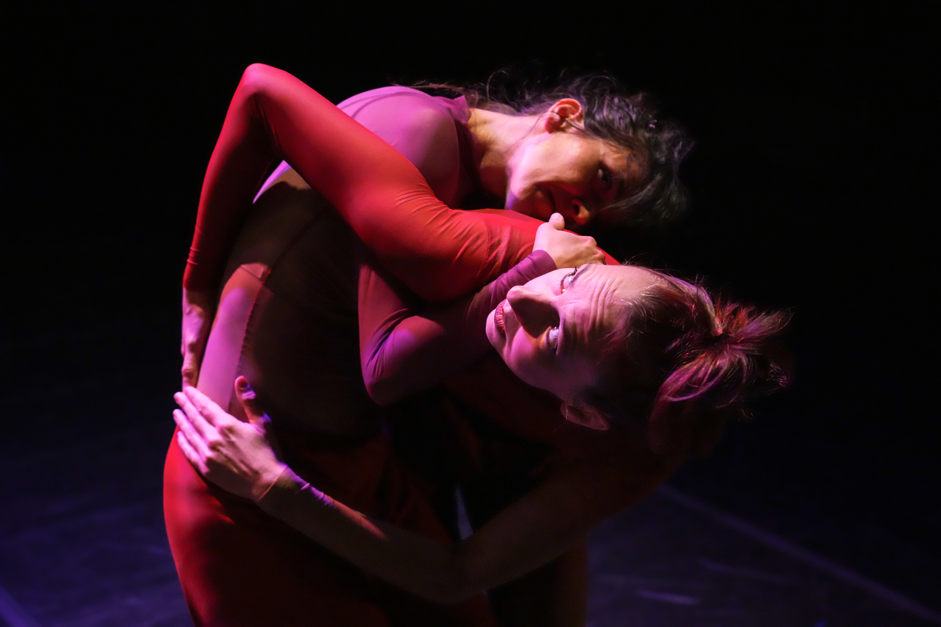 Two dancers perform Combustion